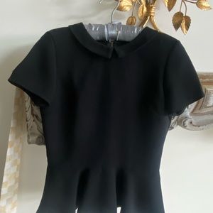 Peplum top . Size 4. Smoke free, pet free household. Black.